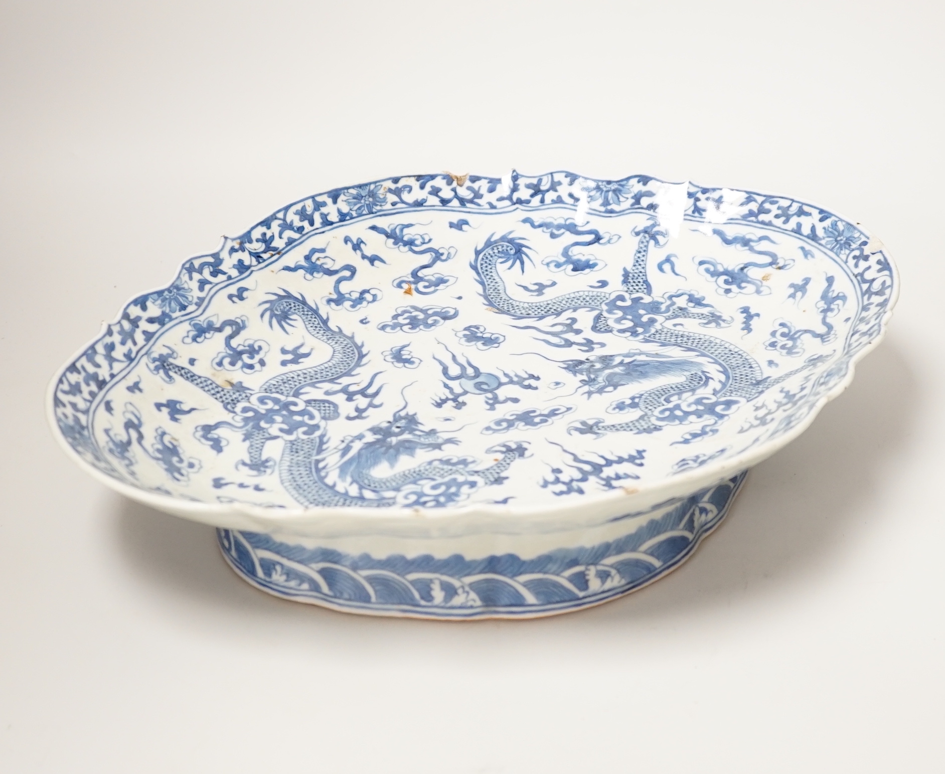 A 19th century Chinese blue and white ‘dragon’ lozenge shaped dish, 39cm